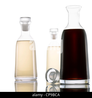 Bottled Light and Dark Vinegar on White Background Stock Photo