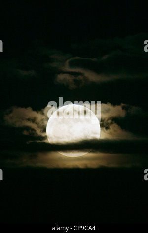 Perigree full moon, or supermoon, rises over Salida, Colorado, USA. Moon is closer to earth in orbit than normal. Stock Photo