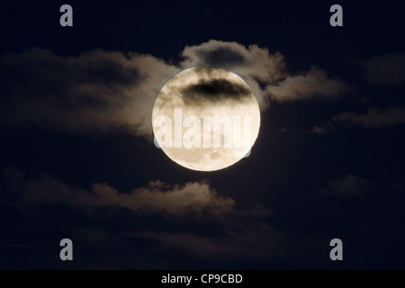 Perigree full moon, or supermoon, rises over Salida, Colorado, USA. Moon is closer to earth in orbit than normal. Stock Photo