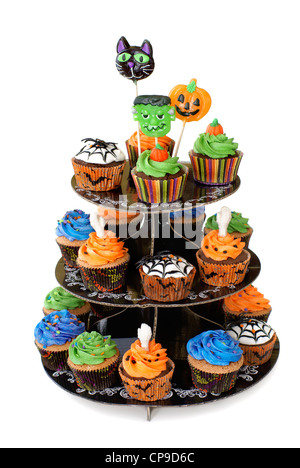 Three tier cupcake stand with lollipops on the top Stock Photo