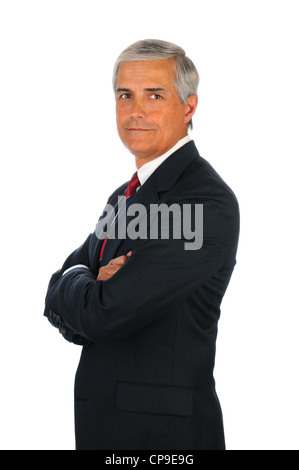 Portrait of a senior business man with his arms crossed. Vertical format isolated on white. Stock Photo