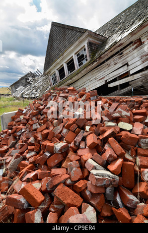 Pile of bricks in front of collapsed building, Hot Lake, Oregon. Stock Photo