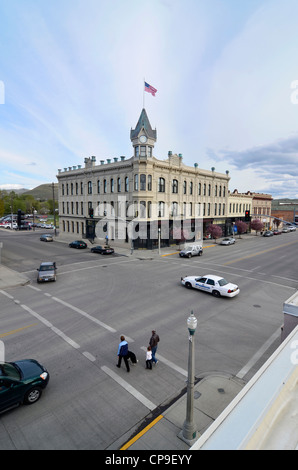 Pedestrians and cars on the street in front of Baker City Oregon's historic Geiser Grand Hotel. Stock Photo