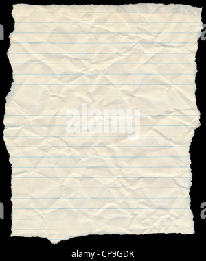 Old yellowing crumpled lined paper torn edges isolated on black. Stock Photo