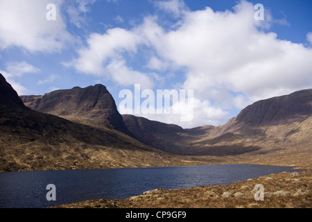 Looking across Loch Coire nan Arr reservoir  towards A'Chioch . Stock Photo