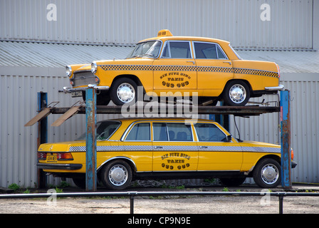 New York style yellow taxi cabs parked on ramp, York,England, UK Stock Photo