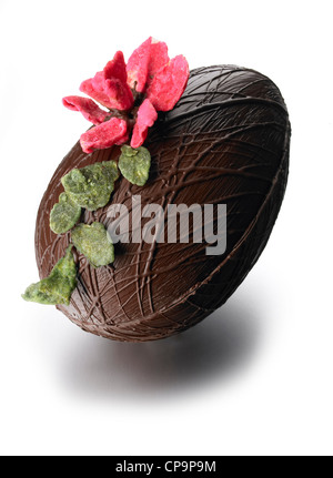 Dark Chocolate Easter Egg candied petals leaves Stock Photo