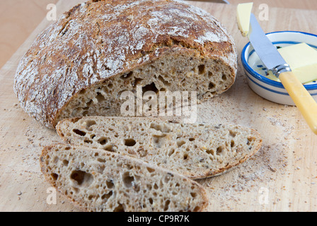 Sourdough bread slicing Stock Photo by grafvision