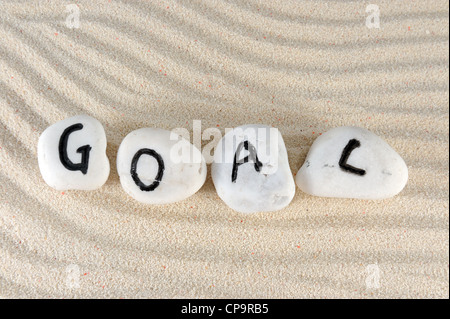 Goal word on group of stones on the sand Stock Photo