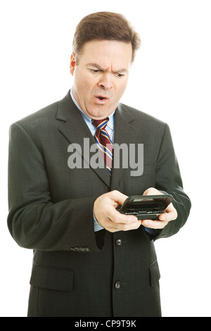 Fortiesh businessman offended by shocking text message. Isolated on white.  Stock Photo