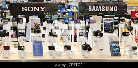 Sony and Samsung cameras on sale in electronic equipment store, Wales, UK Stock Photo