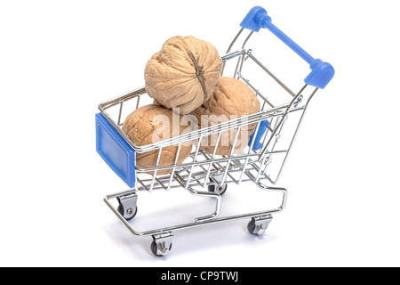 Walnuts in shopping cart isolated on white background Stock Photo