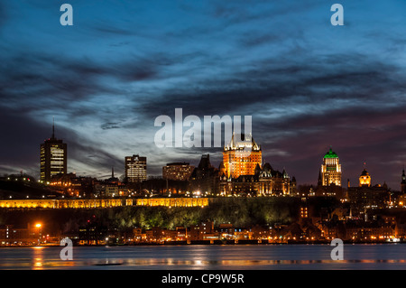 Chateau Frontenac and Old Quebec skyline at sunset from across the Saint Lawrence River in Levis, Quebec, Canada. Stock Photo