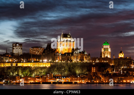 Chateau Frontenac and Old Quebec skyline at sunset from across the Saint Lawrence River in Levis, Quebec, Canada. Stock Photo