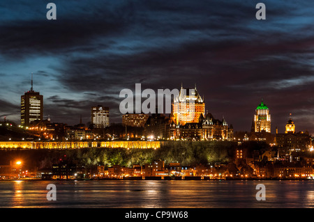 Chateau Frontenac and Old Quebec skyline at sunset from across the Saint Lawrence River in Levis, Quebec, Canada. Stock Photo