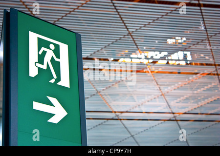 Sign of emergency exit in a Chinese airport, good for conceptual Stock Photo