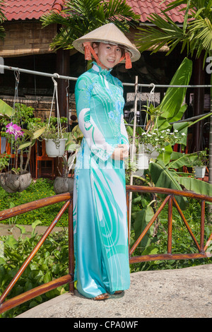 Young woman dressed in traditional style costume, Mekong Delta region, Vietnam Stock Photo