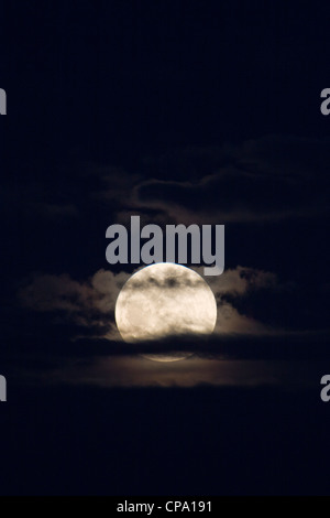 Perigree full moon, or supermoon, rises over Salida, Colorado, USA. Moon is closer to earth in orbit than normal. Stock Photo