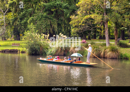 Tourists in a punt on the Avon River, passing through Hagley Park, in Christchurch, New Zealand, 6 February 2011. Stock Photo