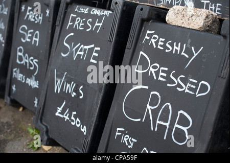 Fish for sale signs on blackboards at Aldeburgh Suffolk UK Stock Photo