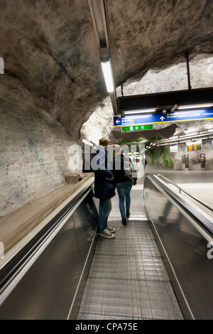 Teenage couple at a subway station Stock Photo