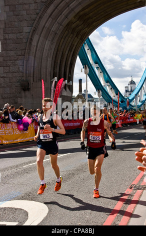 London 2012 marathon runners crossing iconic grade 1 listed Tower Bridge London England Europe Stock Photo