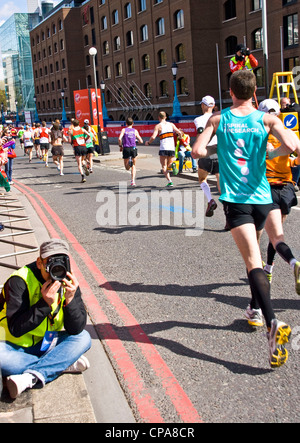 2012 London marathon runners crossing grade 1 listed Tower Bridge London England Europe Stock Photo