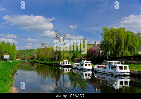 Three canal barges moored on on the Yonne River, Canal du Nivernais France. Stock Photo