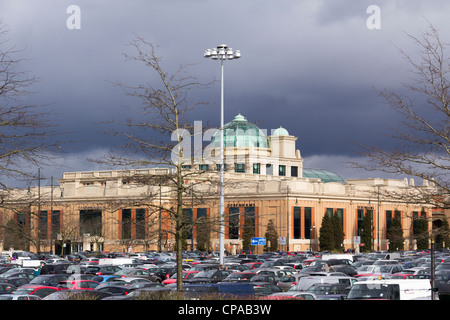 Car park and north west entrance to the Trafford Centre near Manchester. This end of  the Centre is fronted by Debenhams. Stock Photo