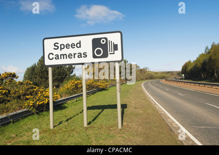 Speed Cameras sign beside a main dual-carriageway road. Stock Photo