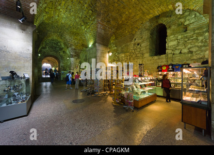 Split, Dalmatian coast of Croatia - Diocletian's Palace, old walled heart of city. Shops in the vaults or cellars of the palace. Stock Photo