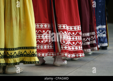 USA, North Carolina, Cherokee. Costumes worn by a Choctaw Indian women on stage during the Southeast Tribes Festival. Stock Photo