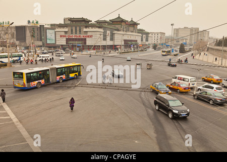 Traffic near the Temple of Heaven, Beijing, China. The brown haze is caused by a sandstorm. Stock Photo