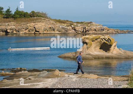 USA, WA, San Juan Islands. Picturesque Ewing Cove of Sucia Island State Park. Eroded sandstone formations. Stock Photo