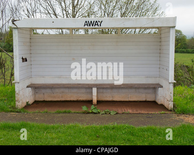 Away team dug out at local football pitch Stock Photo