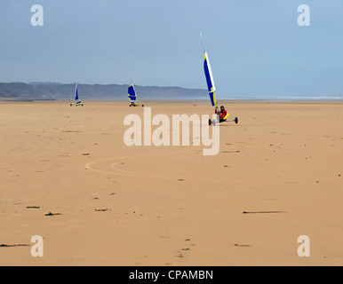 Beach yachting on the five mile Omaha Beach in Normandy.  The long sandy beach is ideal for sail wagons. Stock Photo