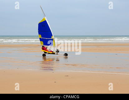 Land sailing on Omaha Beach in Normandy. The long sandy beach is ideal for sand yachts. Stock Photo