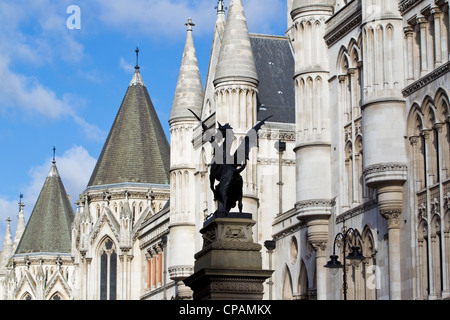 Temple Bar marker topped by a statue of a dragon, in front of the Royal Courts of Justice, High Court, London, UK. Stock Photo