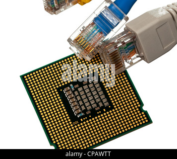 Macro shot of plugs on cat5e cables of many colors isolated against white background on top of exposed CPU chip Stock Photo