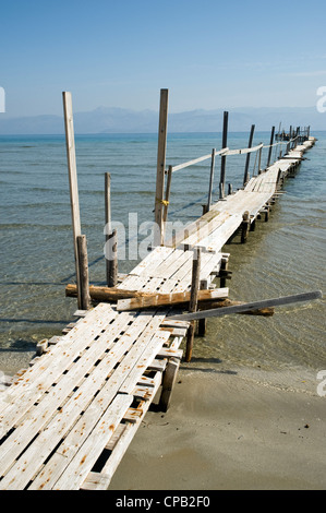 Jetty at Kalamaki beach, with Albania in the background. Corfu Greece. Stock Photo