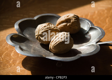 Walnuts on the decorative metal plate Stock Photo