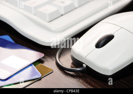 keyboard, mouse, credit card on the table closeup Stock Photo