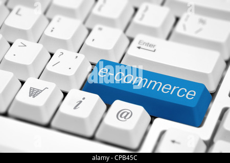 e-commerce key on a white keyboard closeup. E-commerce concept image. Stock Photo