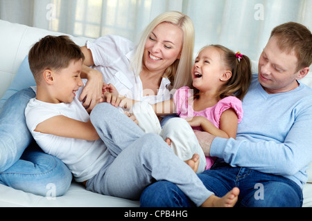 Portrait of happy family playing and laughing Stock Photo