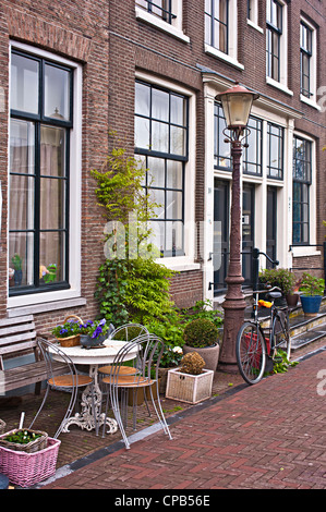 AMSTERDAM, NETHERLANDS - MAY 08, 2012:  Pretty houses in the quiet Jodenbreestreet street Stock Photo
