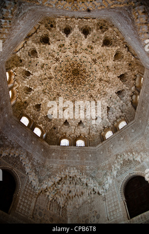 An ornately decorated ceiling crowns the Hall of the Abencerrages in the Nasrid Palaces of the Alhambra in Granada, Spain. Stock Photo