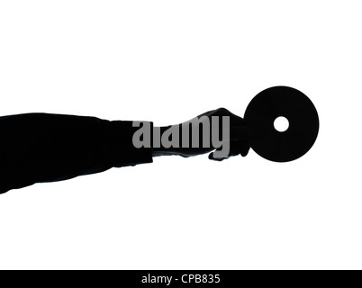 one caucasian business man hand holding compact dvd disk silhouette in studio isolated on white background Stock Photo