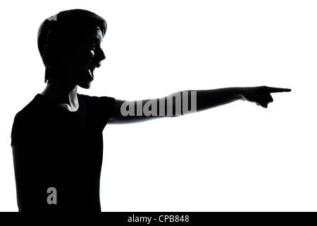 one caucasian young teenager silhouette boy or girl pointing laughing  portrait in studio cut out isolated on white background Stock Photo