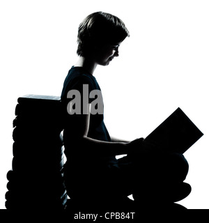 one caucasian young teenager silhouette boy or girl reading full length in studio cut out isolated on white background Stock Photo