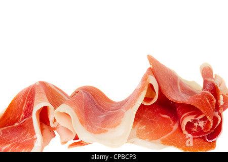 closeup of a pile of spanish serrano ham isolated on white Stock Photo